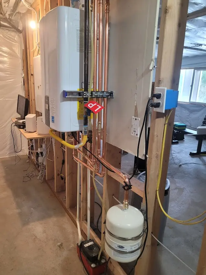 Licensed plumber repairing a kitchen sink in Lyman